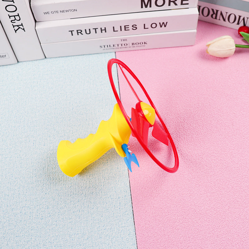 Colorful toy with a red and yellow design on a pink and blue background