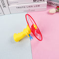 Colorful toy with a red and yellow design on a pink and blue background