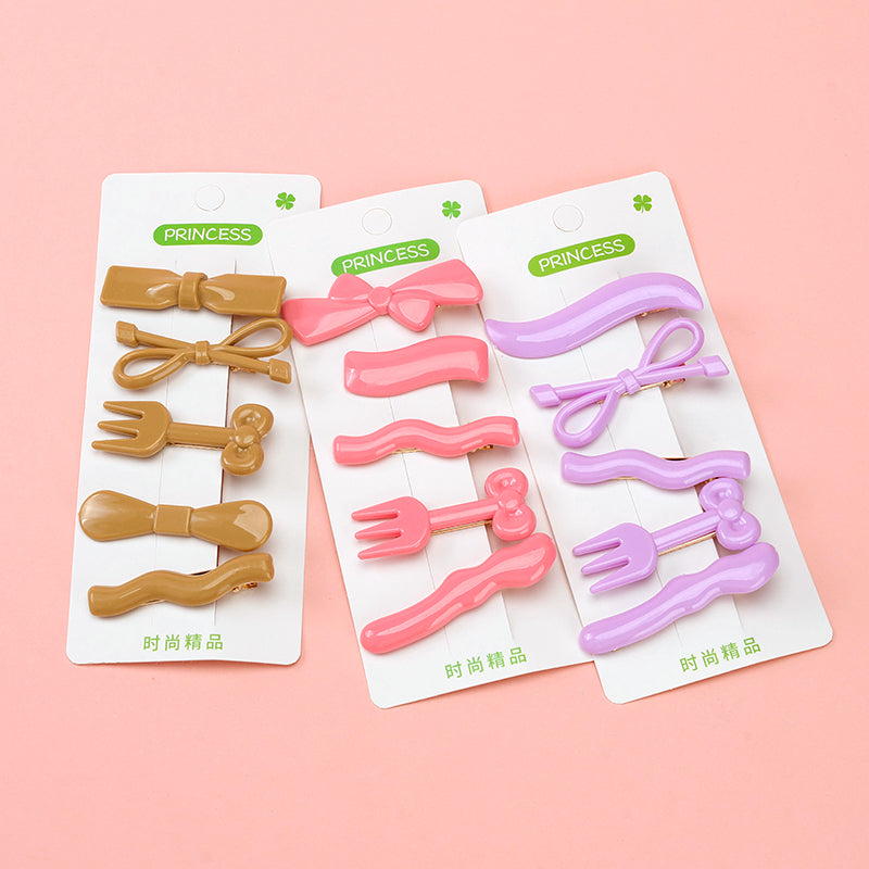 Set of colorful hair clips on packaging with 'Princess' branding against a pink background
