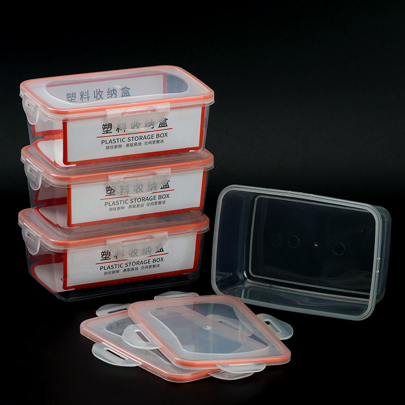Stack of plastic storage boxes with clear lids on a black background