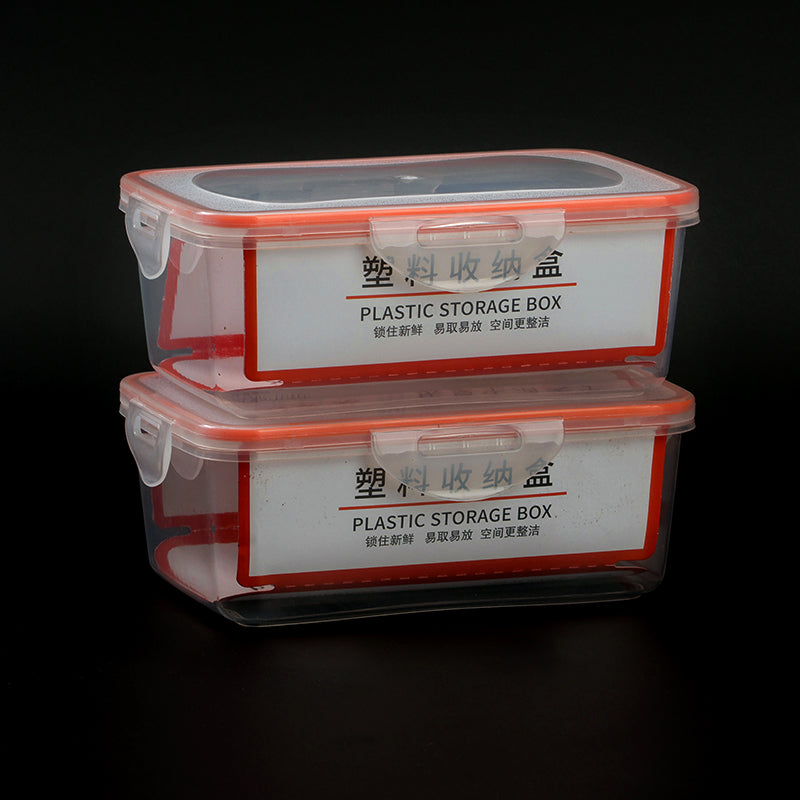 Two plastic storage boxes with red lids on a black background