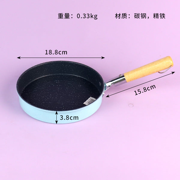 Small frying pan with measurements on a purple background