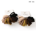 Set of hair ties in various colors with 'Duo Qiao' packaging on a white background