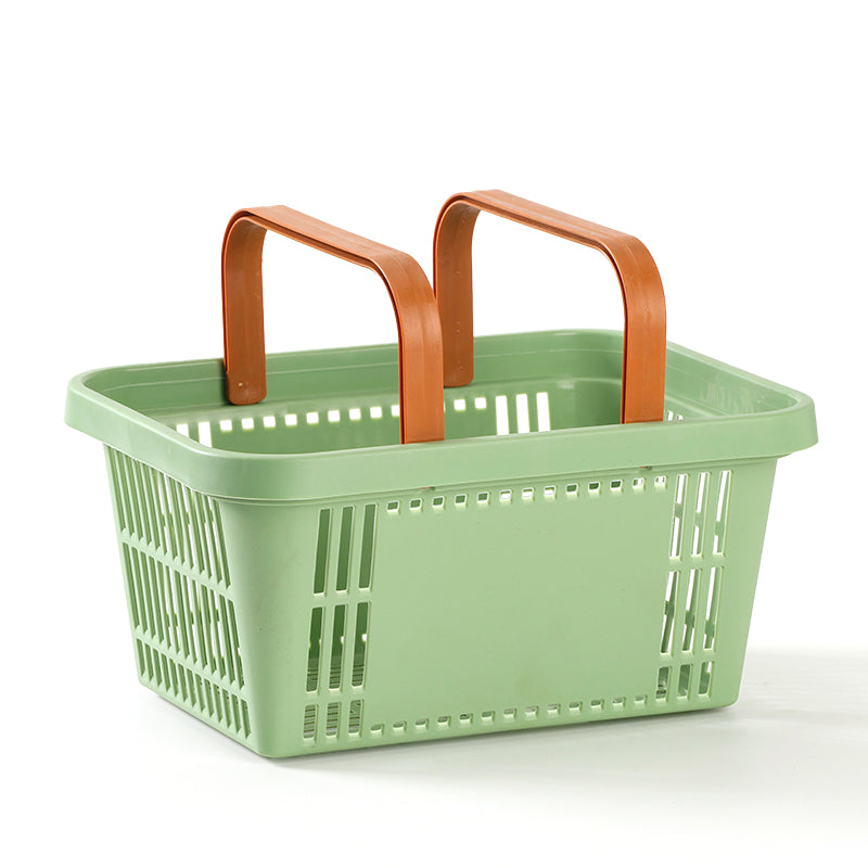 Green shopping basket with brown handles on a white background