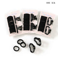Set of black hair ties and clips on white background